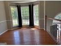 Bright and airy living room boasting hardwood floors, large bay window, and neutral paint at 2828 Hicks Sw Rd, Marietta, GA 30060