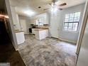 Bright kitchen features a combination of white cabinets and modern countertops at 578 Lakeridge Se Cir, Conyers, GA 30094