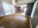 Spacious living room with plush carpeting and abundant natural light at 578 Lakeridge Se Cir, Conyers, GA 30094