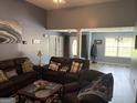 Comfortable living room featuring plush seating and stylish decor in neutral color tones, perfect for relaxing and entertaining guests at 565 Miles Ct, Locust Grove, GA 30248
