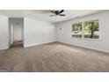 A second view of the living room showing the front door and lots of light at 37 S Forty Pass W, Hiram, GA 30141