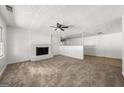 Bright living room with a cozy fireplace and neutral carpeting at 37 S Forty Pass W, Hiram, GA 30141
