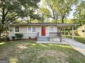 Inviting single-story home with carport, freshly painted and landscaped front lawn at 250 Glenrose Sw Cir, Atlanta, GA 30354