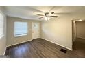 Cozy living room featuring modern flooring, neutral paint and bright window at 250 Glenrose Sw Cir, Atlanta, GA 30354
