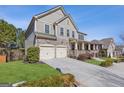Beautiful home with a two-car garage, stone accents, and well-maintained landscaping at 3213 Blackley Old Rd, Douglasville, GA 30135