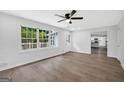 Bright living room with hardwood floors, large windows, and white trim at 3440 Concord Se Cor, Conyers, GA 30013