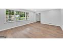 Bright living room with hardwood floors and large windows at 3440 Concord Se Cor, Conyers, GA 30013