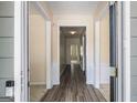 Inviting foyer with hardwood floors and neutral paint creates a warm and welcoming entrance to the home at 3634 Cape Ln, Conyers, GA 30013