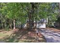 Charming two-story home with a stone accent, attached garage and professionally landscaped front yard at 5362 Kelleys Mill Cir, Stone Mountain, GA 30088