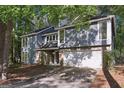 Charming two-story home with a stone accent, attached garage and professionally landscaped front yard at 5362 Kelleys Mill Cir, Stone Mountain, GA 30088