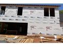 View of new home under construction with window and door placement details at 95 Cambridge, Covington, GA 30014