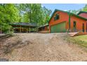 Spacious garage and covered parking area providing ample space for vehicles and equipment at 3313 Henson Ln, Stockbridge, GA 30281