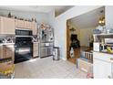 Functional kitchen with stainless steel appliances, tile floors, and plenty of counter space at 2804 Davis Mill N Rd, Dallas, GA 30157