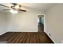 This spacious living room features beautiful wood floors and a modern ceiling fan with lighting at 4487 Greenleaf Sw Cir, Atlanta, GA 30331