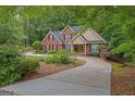 Lovely home with a winding driveway, well-maintained landscaping, and inviting front entrance at 30 Joe Lee Dr, Sharpsburg, GA 30277