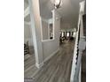 Inviting foyer with views into the living and dining spaces featuring elegant flooring and neutral paint at 3006 Fairway Dr, Villa Rica, GA 30180