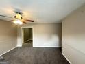Spacious living room with neutral color walls and carpeted floors, ready for personalization at 6309 Wellington Way, Austell, GA 30106