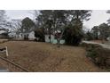 Charming single-story home with a welcoming screened front porch and a yard covered in fallen leaves at 2010 Mcafee Pl, Decatur, GA 30032