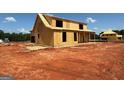 New two-story home under construction with a partially covered front porch at 242 Old Jackson Rd, Mcdonough, GA 30252