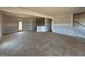 Spacious living area with unfinished walls, light-filled windows, and an open floor plan at 242 Old Jackson Rd, Mcdonough, GA 30252