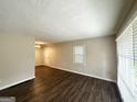 Spacious living room featuring hardwood floors, neutral walls, and plenty of natural light at 2851 Mitchell Dr, Decatur, GA 30032
