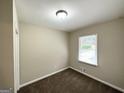 Bright bedroom featuring neutral walls and a window at 2215 Rosewood Rd, Decatur, GA 30032