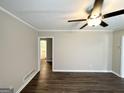 A cozy living room with hardwood floors and a ceiling fan at 2215 Rosewood Rd, Decatur, GA 30032