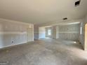Spacious living room with drywall walls and a large open layout, ready for customization at 252 Old Jackson Rd, Mcdonough, GA 30252