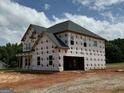 New two-story home with black roof and multiple windows wrapped in Tech-Wrap at 252 Old Jackson Rd, Mcdonough, GA 30252
