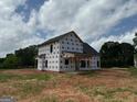 Exterior view of a two-story house under construction on a sunny day at 1916 King Mill Rd, Mcdonough, GA 30252
