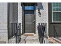 A welcoming entrance with a stylish front door, decorative plants, and a charming 'Hello' doormat at 4760 Highside Way, Smyrna, GA 30082
