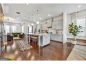 Spacious kitchen with a large island, modern appliances, hardwood floors, and seamless flow into the living area at 4760 Highside Way, Smyrna, GA 30082