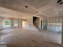 Unfinished living room showcases a spacious layout, natural light, and staircase at 1936 King Mill Rd, Mcdonough, GA 30252