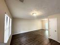Bright living room featuring wood floors, a neutral color palette, and lots of natural light at 3879 Mcgill Ln, Decatur, GA 30034