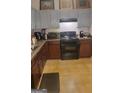 Functional kitchen featuring essential appliances and ample countertop space at 6880 Mountain Cir, Riverdale, GA 30274