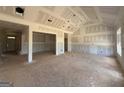 Spacious living room under construction with vaulted ceiling and ample natural light at 1926 King Mill Rd, Mcdonough, GA 30252