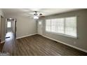 Bright living room features hardwood floors, ceiling fan, and a view of the entry door at 2651 Lois Se Ln, Atlanta, GA 30315