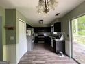Spacious kitchen with stainless steel appliances and dark cabinetry at 150 Doe Run Ct, Sharpsburg, GA 30277