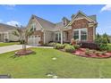 Attractive single Gathering home with vibrant landscaping and a two-car garage at 500 Cottonwood Cir, Peachtree City, GA 30269
