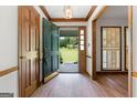 Bright foyer with wood floors, coat closet, and an open view to the front yard at 41 Ridgewood Cir, Mcdonough, GA 30252