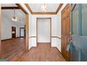 Inviting foyer features wood flooring, a coat closet and opens to the spacious living area at 41 Ridgewood Cir, Mcdonough, GA 30252