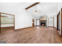 Spacious living room features vaulted ceiling, stone fireplace, and wood-look flooring at 41 Ridgewood Cir, Mcdonough, GA 30252