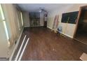 Spacious living room featuring a classic fireplace and hardwood floors at 4060 Sumit Wood Nw Dr, Kennesaw, GA 30152
