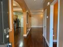 Home entryway featuring arched doorways and hardwood floors at 1218 Heartwood Ave, Mcdonough, GA 30253