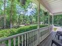 Covered porch area with seating and views of the landscaped front yard at 175 N Unity Grove Rd, Locust Grove, GA 30248