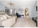 Open-concept living room with high ceilings, arched doorways, and built-in bookshelves at 100 Gum Creek Landing, Oxford, GA 30054