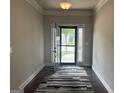 Inviting entryway features a decorative rug and an open door showcasing the exterior at 3970 Lagrone St, Powder Springs, GA 30127