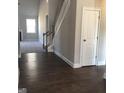 Inviting foyer with hardwood floors, staircase, and access to living areas, offering a warm welcome at 3970 Lagrone St, Powder Springs, GA 30127