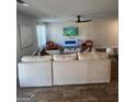 Cozy living room with a comfortable sofa, modern fireplace, and a ceiling fan at 4831 Station Lane # 29, Union City, GA 30349