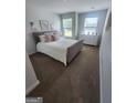 Cozy bedroom with plush carpeting, natural light, and a comfortable bed with stylish decor at 4838 Station Lane # 15, Union City, GA 30349